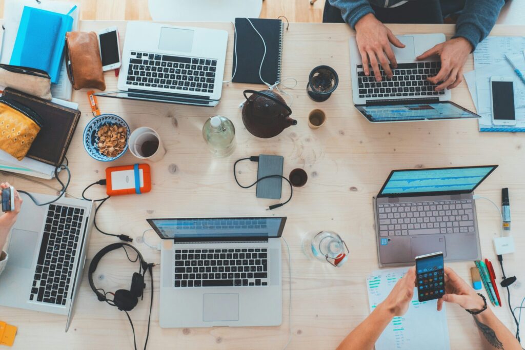 People at Table with Laptops