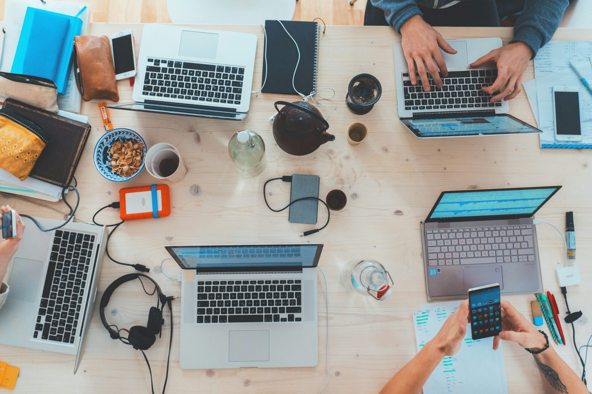 People at Table with Laptops